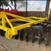 Used yellow disc harrow for soil preparation – secondhand farming equipment in South Africa